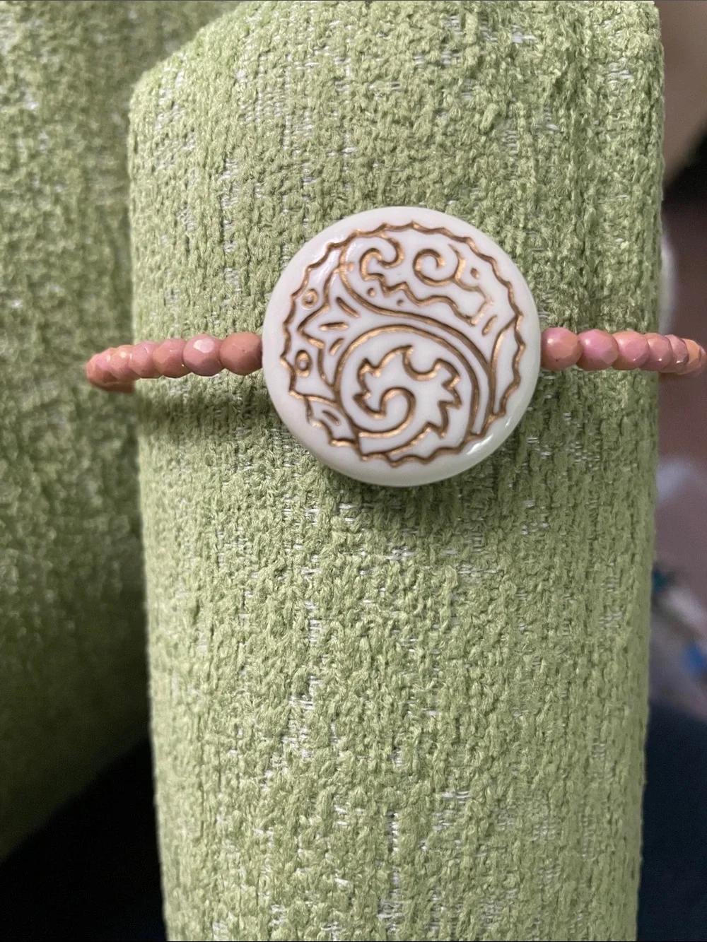 Clay Colored Beaded Bracelet with Off- White Gold-Trimmed Plastic Medallion